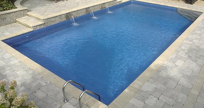Clearance 18 x 36 ft Custom Rectangle Inground Pool with Angled Corner and Full White Beach Pebble Liner Pattern